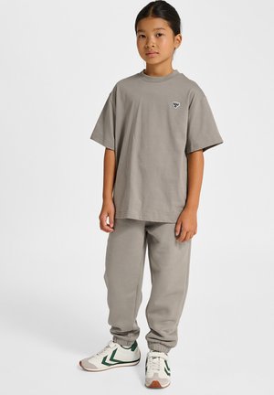 Gray cotton t-shirt with a round neck and short sleeves, paired with matching sweatpants. Sneakers feature white, green, and tan accents.