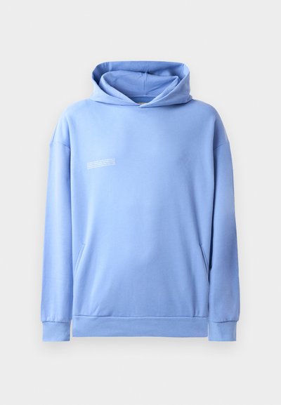 Light blue hoodie made of soft fabric, featuring a kangaroo pocket, a drawstring hood, and minimal text detail on the front.