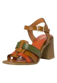 Multi-colored sandal with woven leather straps in orange, green, and brown. Features a chunky brown heel and a gold-tone buckle.