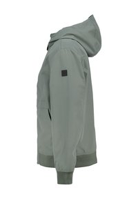 Light grey hooded jacket featuring a zip front, elastic cuffs, and a small logo patch on the sleeve. Smooth, water-repellent fabric.