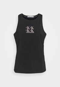 Svart ärmlös bomullstopp med en ljusrosa logotyp som har upprepade bokstäver "CK" och "CALVIN KLEIN JEANS" i mitten.