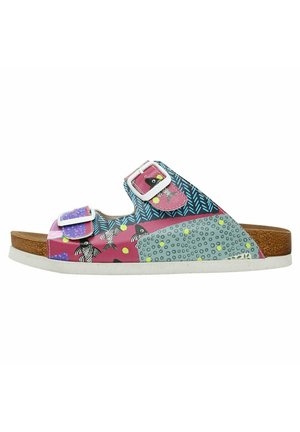 Two-buckle sandal with a cork footbed. Features a multicolored, patterned upper with fish, dots, and abstract designs. White outsole.