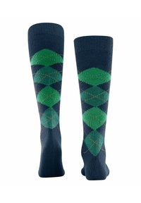 Calze al ginocchio color navy con un motivo argyle verde e dettagli arancioni. Realizzate in un materiale liscio e elastico.