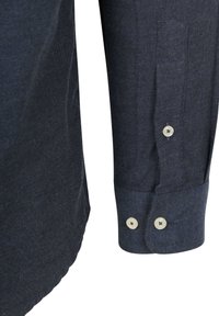 Donkerblauwe shirt van textuurstof, met lange mouwen, een twee-knopen manchet en een gebogen zoom.