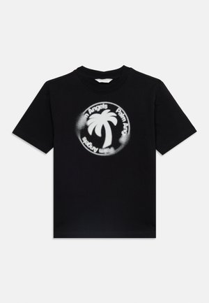 Camiseta negra de manga corta con un logo circular blanco de una palmera y el texto "Palm Angels" alrededor en el pecho.