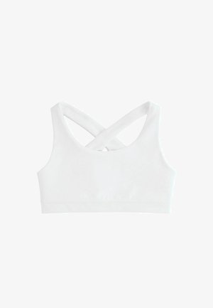 Brassière de sport blanche avec de larges bretelles croisées dans le dos et une finition lisse et sans coutures.