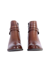 Brown leather ankle boots with two decorative straps and a side zipper. Smooth texture, rounded toe, and a low-profile sole.