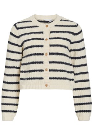 Krem pulover iz pletenine s črnimi vodoravnimi črtami in petimi lesenimi gumbi po sredini spredaj.