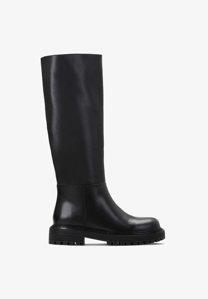 Black knee-high boots made of smooth leather. Features a rounded toe, sturdy sole with ridges, and minimalistic design.