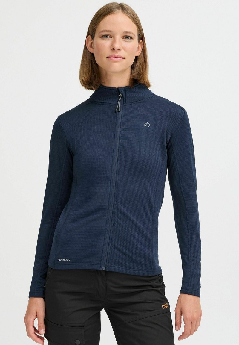 Navy zip-up jacket with a textured design, stand collar, and long sleeves. Features a logo patch and "Quick Dry" branding at the hem.