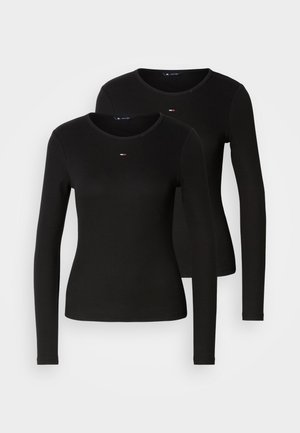 Zwarte longsleeves met ribbeltextuur, ronde halsontwerp en een klein logo-detail op de borst. Twee kledingstukken samen weergegeven.