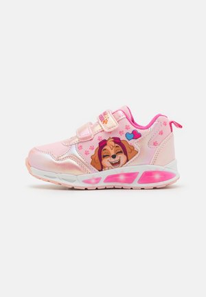 Pink athletic shoe with a shiny finish, featuring a dog graphic, Velcro strap, and light-up sole. Textured detail on the sides.