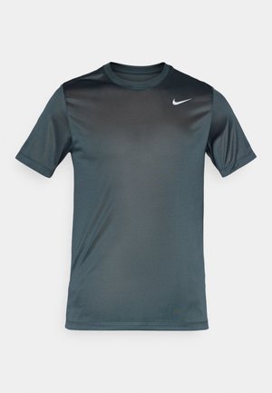 Nike short-sleeve t-shirt in dark teal, made of smooth, breathable fabric. Features a subtle gradient and a white logo on the chest.