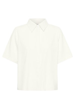 Cămașă albă cu mâneci scurte și nasturi, cu guler ascuțit, prezentând o croială lejeră și dreptunghiulară și un design curat, minimal.