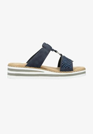 Blue suede slide sandal with a beaded accent, featuring a cushioned midsole and a white striped outsole for traction.