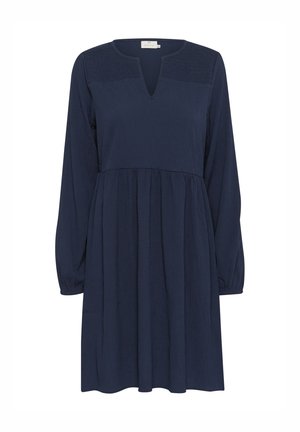 Navy blue dress with long sleeves, V-neckline, gathered waist, and textured bodice. Flowing fabric and slightly A-line shape.