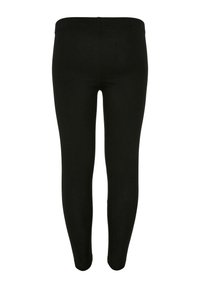 Leggings noirs au design ajusté, avec une texture lisse et un tissu extensible. Pas de coutures visibles ni d'ornements.