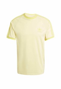 Ljusgul bomulls T-shirt med rund halsringning, korta ärmar och tre tunna sidosträck. Har en präglad Adidas-logotyp på bröstet.