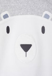 White fleece sweatshirt with a large bear face design, featuring embroidered details in gray and black, and rounded ears in light blue fabric.