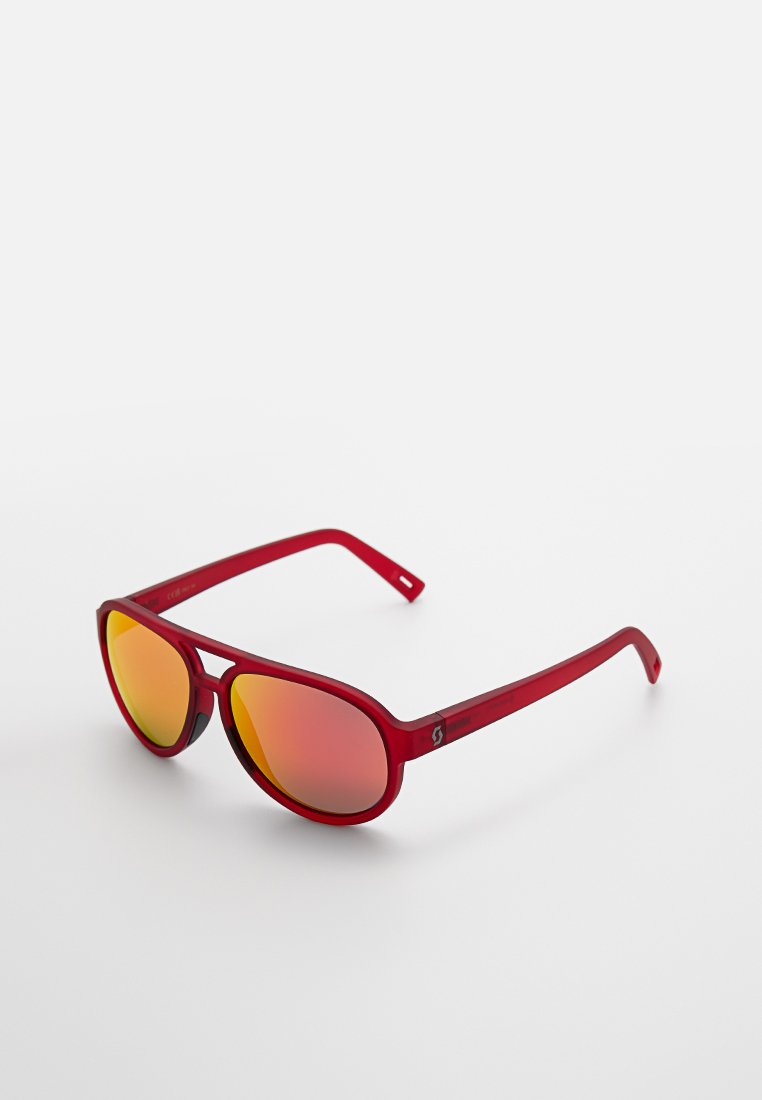 Gafas de sol rojas de plástico con lentes ovalados que presentan un tinte degradado naranja reflectante y patillas delgadas. Diseño ligero con un discreto detalle de logo.