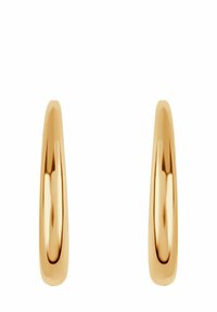 Złote kolczyki w kształcie kół o gładkim, wypolerowanym wykończeniu. Posiadają uproszczony, wydłużony owalny kształt. Minimalistyczny design bez ozdób.