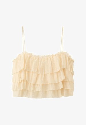 Haut court crème à bretelles spaghetti avec volants superposés et tissu texturé.