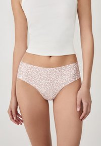 Leopard print underwear in soft pink fabric, featuring a low-rise design and smooth texture. Stretched waistband without additional hardware.