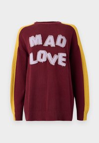 Knitted sweater in burgundy with yellow shoulder stripes. Features "MAD LOVE" in textured, stitched letters. Ribbed cuffs and hem.