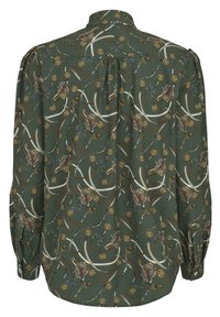 Green patterned shirt featuring a mix of tiger, whip, and geometric designs. Long sleeves with button cuffs; smooth texture, collared neckline.