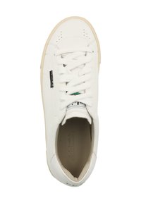 White leather sneaker with rounded toe, flat laces, and perforated detailing. Features a textured sole and a modest logo tag on the side.
