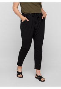 Svarta, avsmalnande byxor med elastisk midja och snörning; har två sidofickor; slät textur och minimalistisk design.