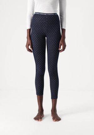 Marineblaue Leggings mit einem subtilen geometrischen Muster, aus weichem Stoff gefertigt; mit einem hohen Taillenbund aus elastischem Material mit Markenlogo und einer figurbetonten Silhouette.