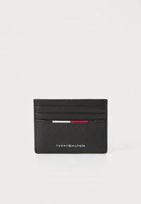 Black leather cardholder featuring multiple card slots, a textured finish, and embossed branding on the front. Compact and sleek design.