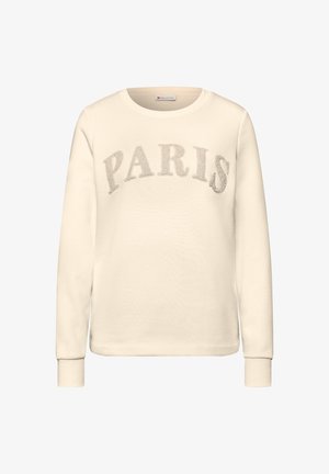 Felpa color crema con la scritta "PARIS" ricamata in grigio tenue sul petto. Presenta un collo tondo e maniche lunghe con polsini a costine.