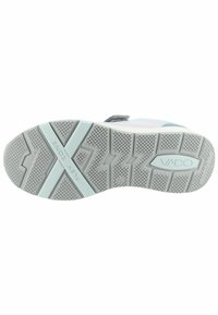 suela de zapato deportivo VADO, de goma texturizada, gris claro con un patrón de zigzag, que presenta una sección "ZONA FLEXIBLE" y un logotipo moldeado de la marca.