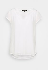 Blouse blanche à manches courtes avec un col en V et des détails en dentelle délicate le long de l'encolure. Texture lisse, coupe décontractée et ourlet arrondi.