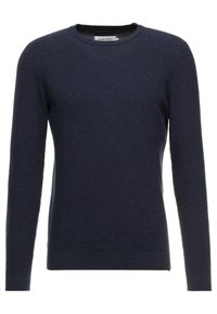 Pull en tricot bleu marine avec un col rond, des manches longues et un tissu texturé. Présente une petite fente sur le côté à l'ourlet.