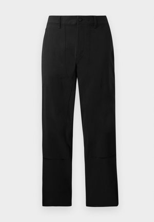 Black trousers made of a smooth fabric, featuring a flat front, two front pockets, and a straight leg cut with subtle stitching details.