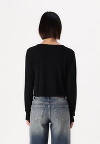Object OBJTHESS  - Vesta na kopčanje - black