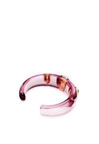 Pink acrylic bangle bracelet with a smooth finish, featuring transparent sections and decorative accents in light and dark hues.