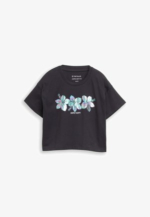 T-shirt nera corta con tre stampe floreali iridescenti e testo "SIMPLY HAPPY" centrato sotto i fiori.