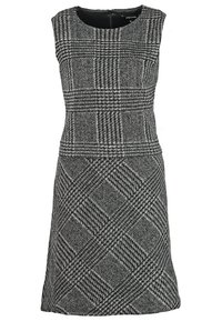Robe sans manches en motif pied-de-poule noir et gris ; coupe ajustée avec une légère évasement à l'ourlet ; encolure ronde classique et fermeture éclair au dos.