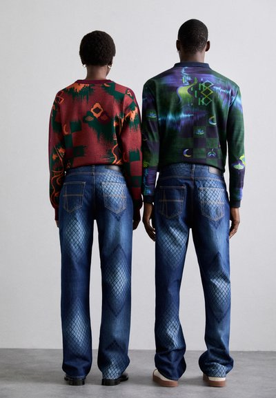 Colorful sweaters with geometric patterns; wide-leg blue jeans with a diamond pattern on thighs; contrasting textures and materials.