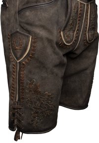 Brown suede lederhosen with intricate embroidery, decorative leather accents, and laced details on the hem and side pockets.