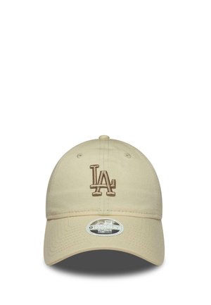 Beige baseball cap with brown "LA" logo embroidered on front and a "9TWENTY Women Adjustable" sticker on the brim.