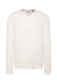 Langärmliges Hemd in Off-White. Hergestellt aus leichtem Baumwollstoff mit V-Ausschnitt, dezent strukturierter Oberfläche und geradem Saum. Markenetikett innen.