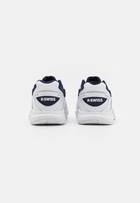 White and navy athletic shoes with mesh and leather materials, featuring a rounded toe, cushioned sole, and K-Swiss logo on the heel.