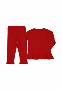 Rød bluse med lange ærmer og peplumflæse, kombineret med matchende røde leggings med flæsekant. Begge lavet af blødt, strækbart stof.