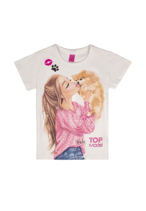 Girl with long hair in pink polka-dot shirt holding and kissing small fluffy dog, with paw print and kiss mark graphics on white shirt.