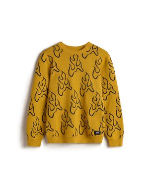 Pull en tricot de couleur jaune moutarde avec un motif de flammes noires. Doté d'un col rond et de poignets et ourlet côtelés. Tissu léger et texturé.